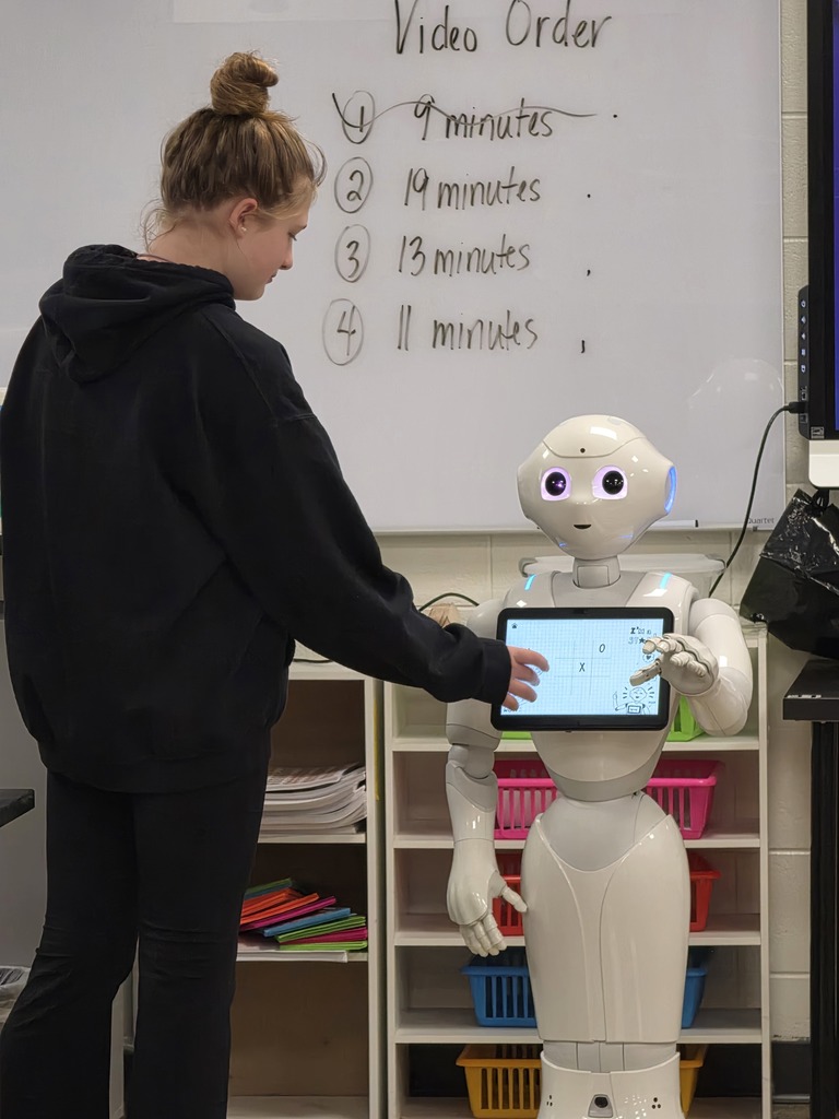 students interacting with a robot