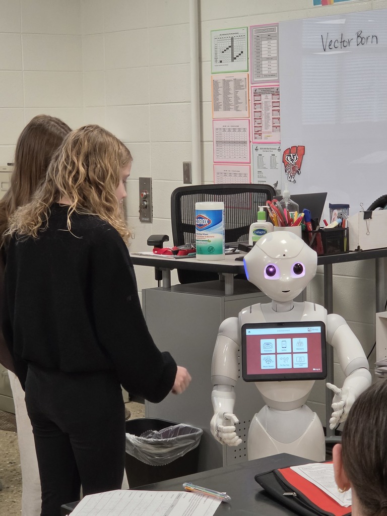 students interacting with a robot