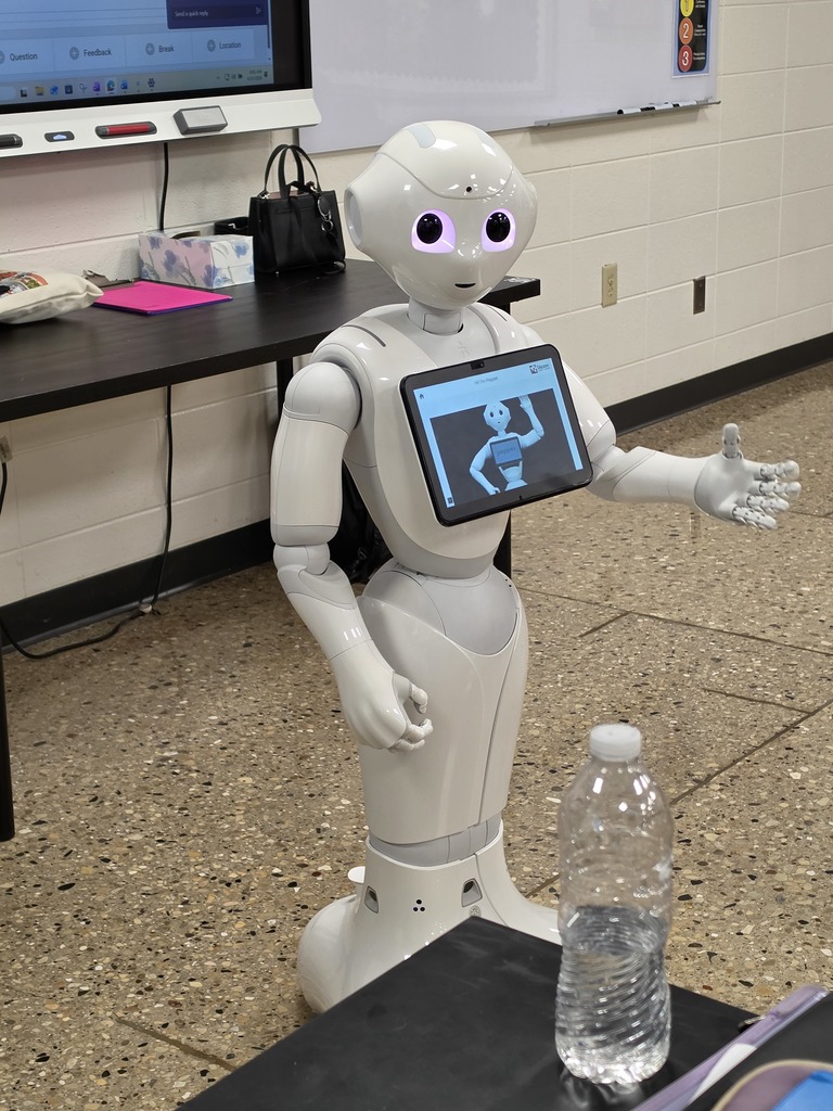 students interacting with a robot