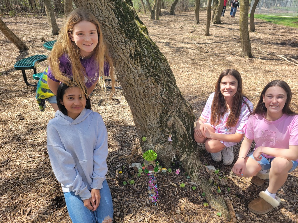 students pose with their completed fairy garden