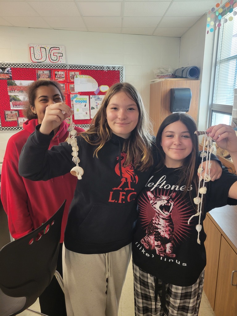 Students posing with their completed projects