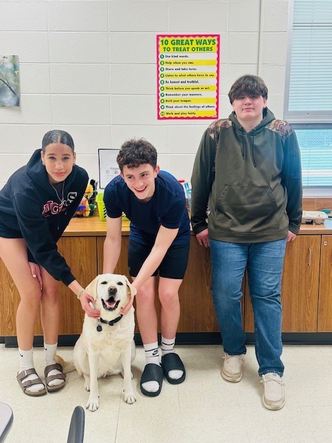 students with therapy dog