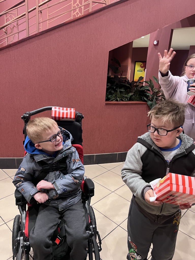 students on a field trip at the movie theater