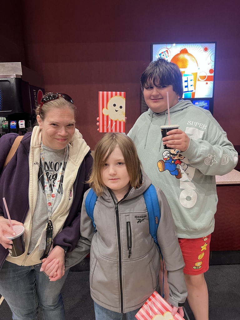 students on a field trip at the movie theater