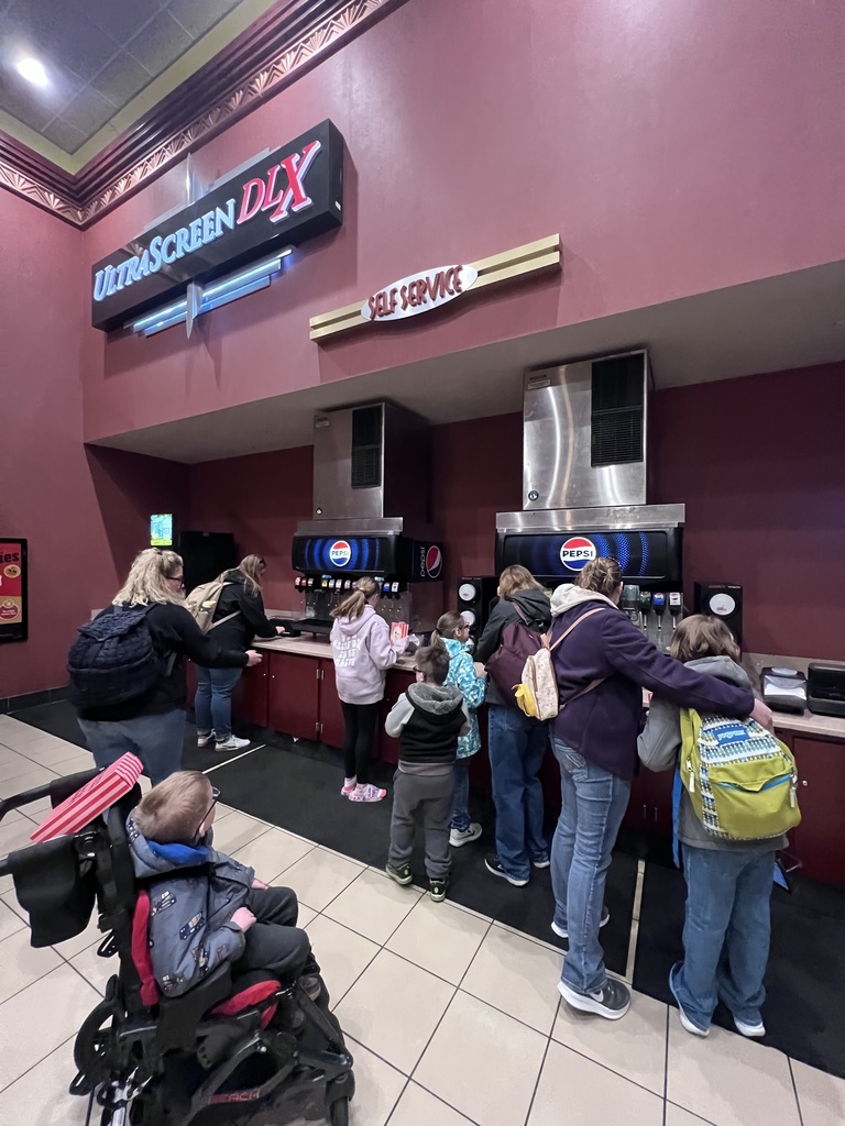 students on a field trip at the movie theater