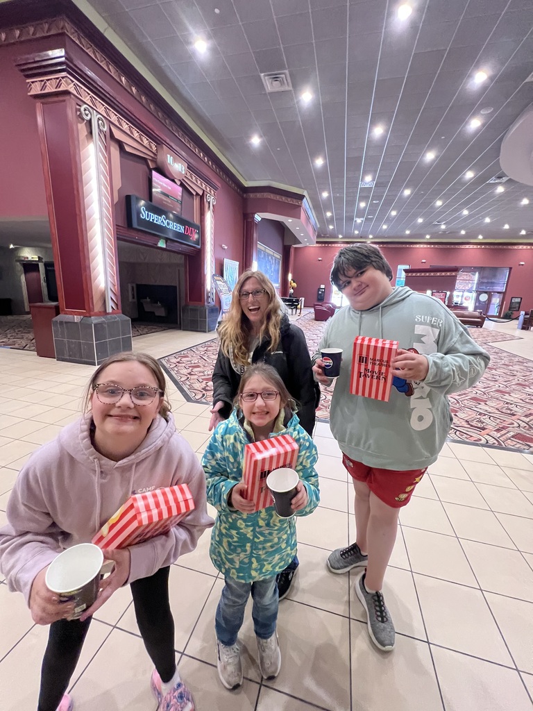 students on a field trip at the movie theater