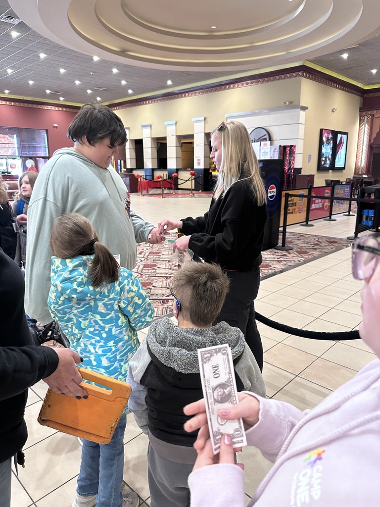 students on a field trip at the movie theater
