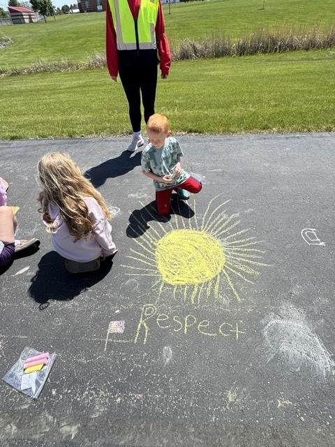 students with their chalk creations