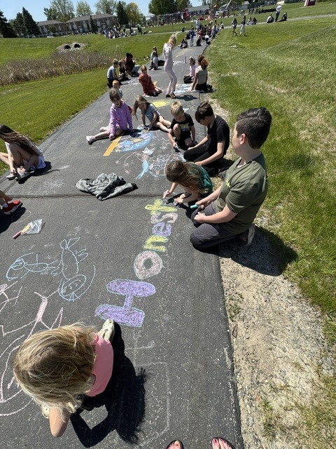 students with their chalk creations