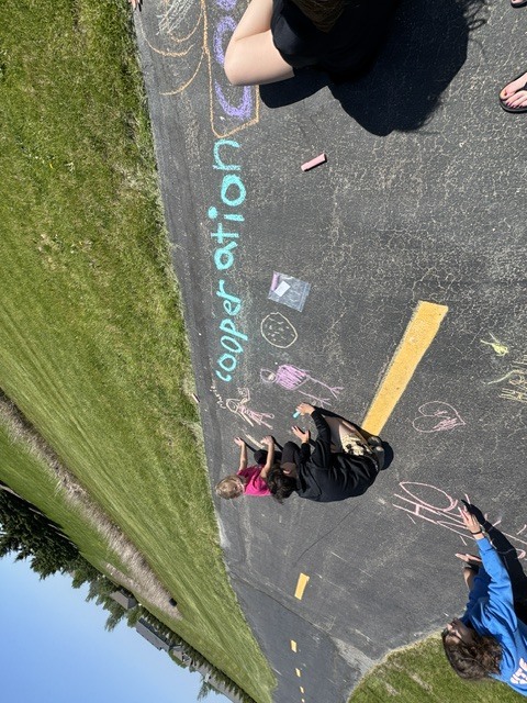 students with their chalk creations