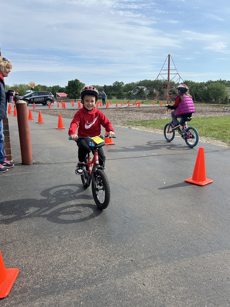 1st graders at the bike rodeo wearing their new helmets