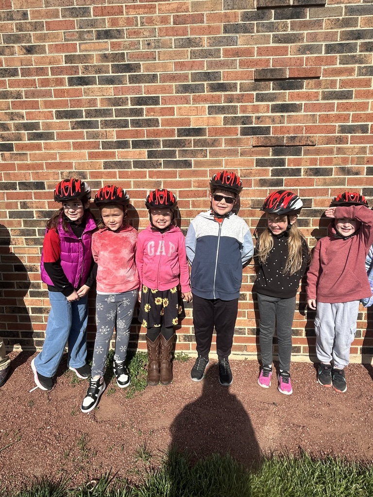 1st graders at the bike rodeo wearing their new helmets