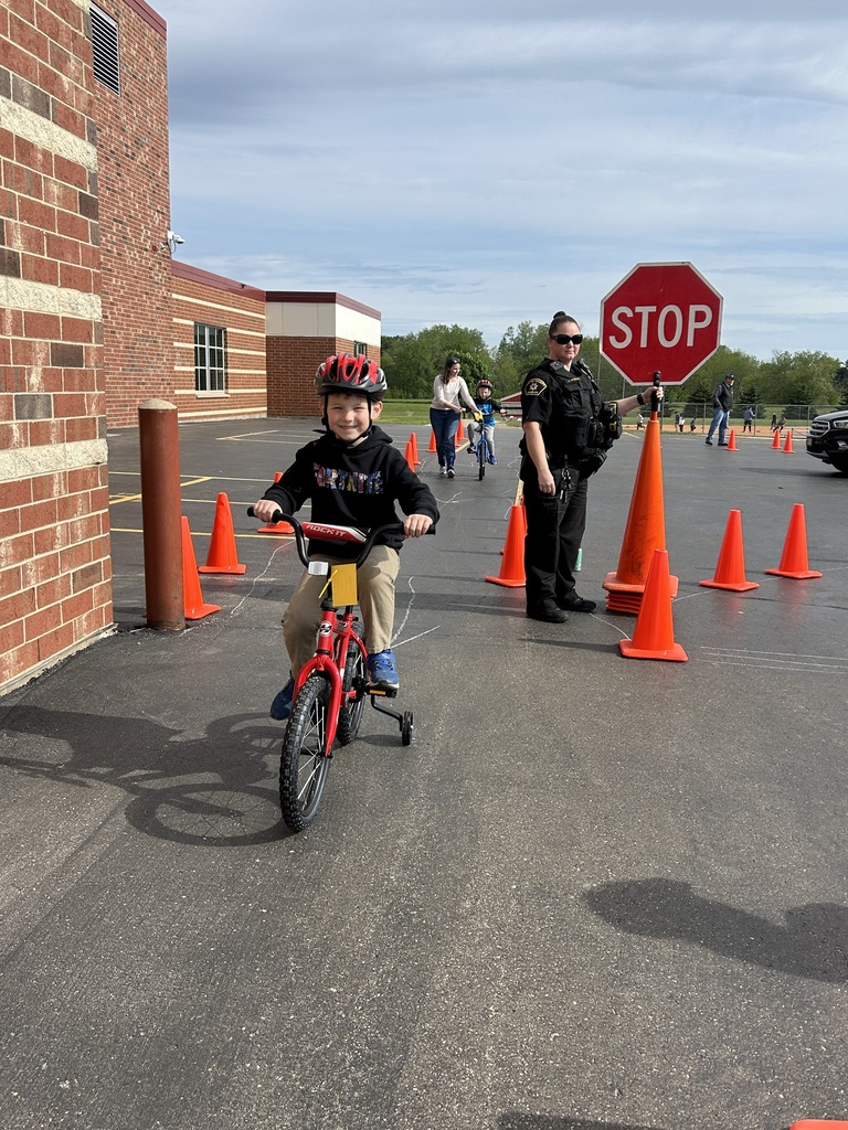 1st graders at the bike rodeo wearing their new helmets
