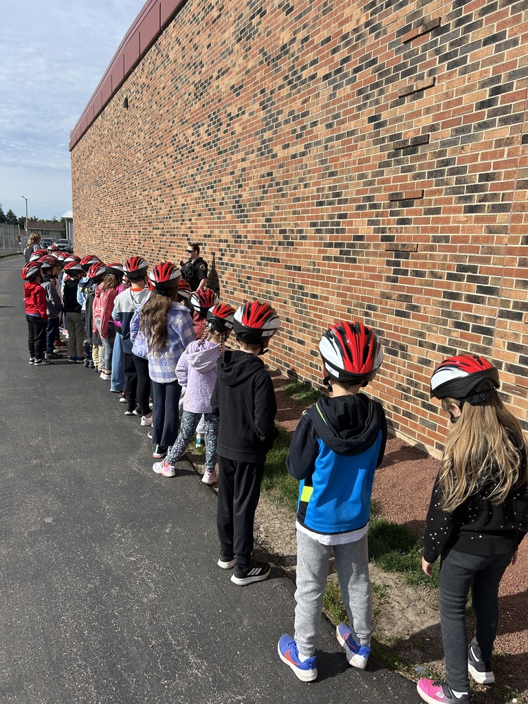 1st graders at the bike rodeo wearing their new helmets