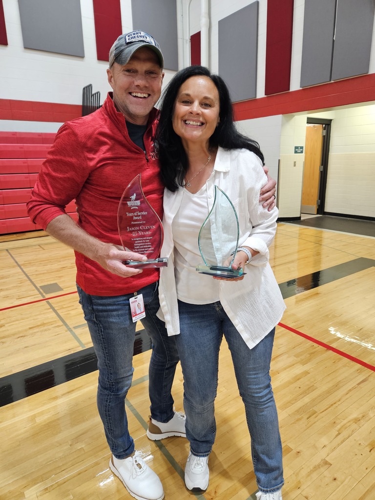 Mr. Cleven and Mrs. Marshall pose with their service awards