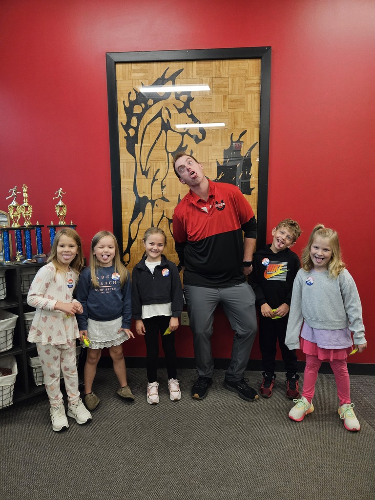 Students make silly faces with Mr. Sams