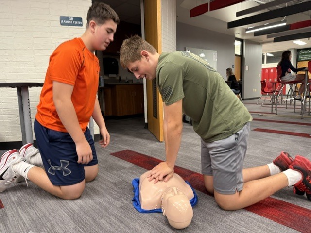 students practice CPR skills