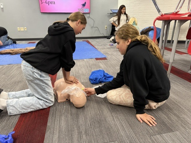students practice CPR skills