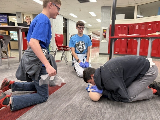 students practice CPR skills