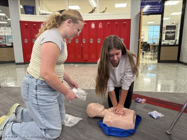 students practice CPR skills
