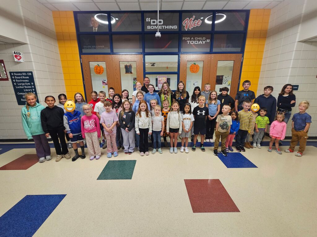 a large group of students pose for a picture