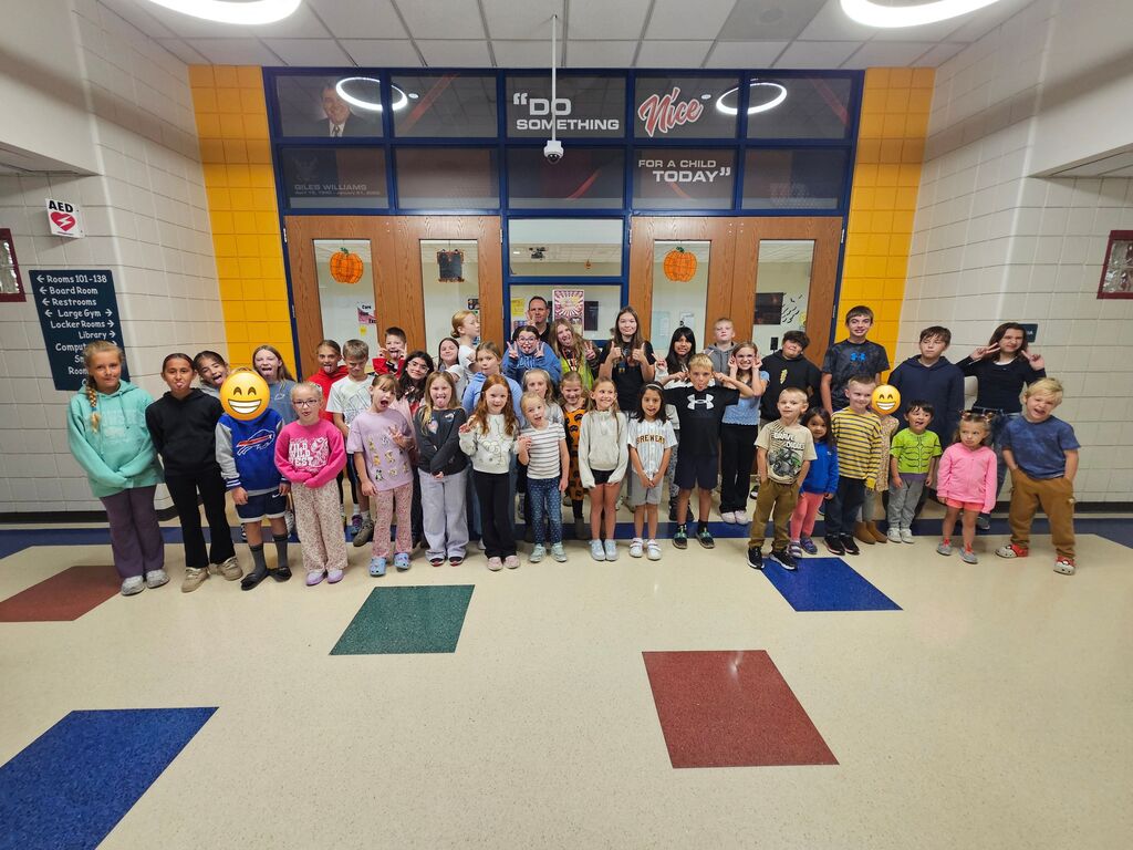a large group of students pose for a picture