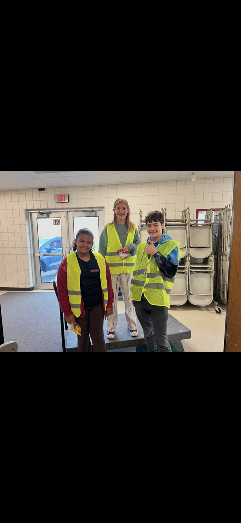 Safety Patrol students pose for a picture in their safety vests