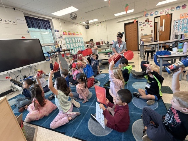 High school students present a lesson to kindergarteners
