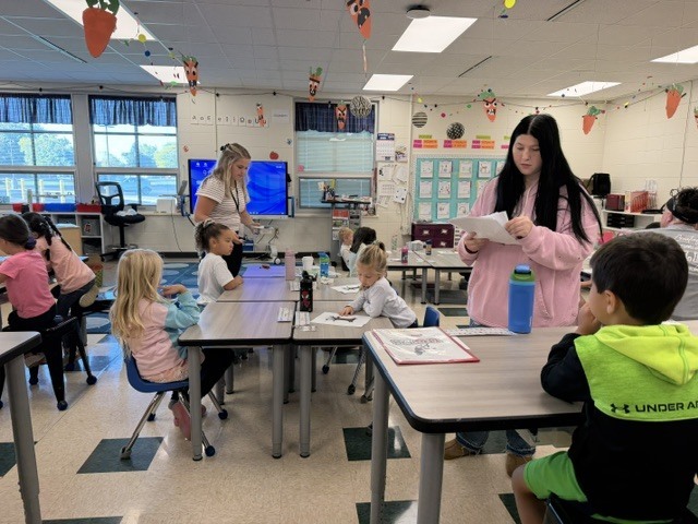 High school students present a lesson to kindergarteners