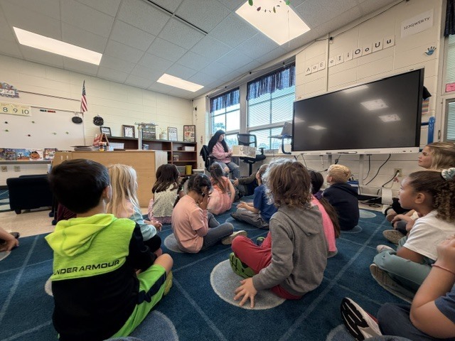 High school students present a lesson to kindergarteners