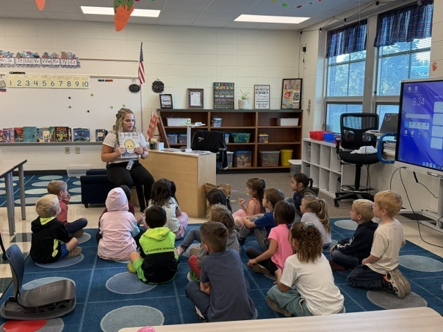 High school students present a lesson to kindergarteners