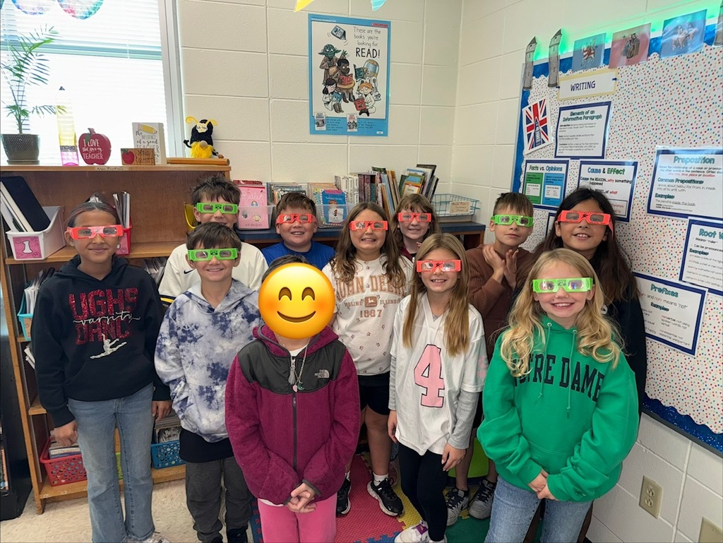 students pose with their glasses on