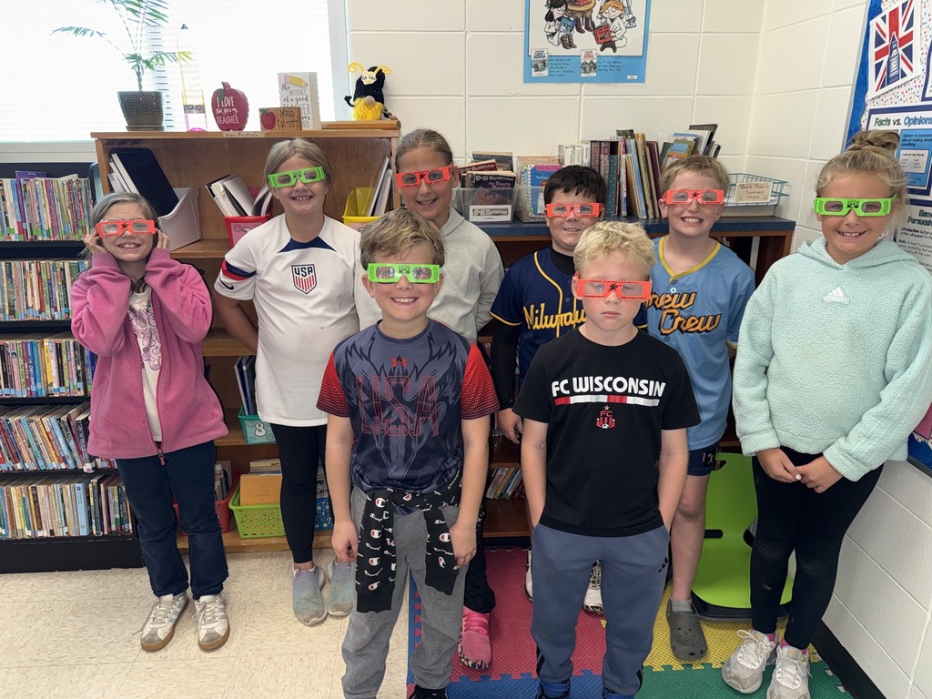 students pose with their glasses on