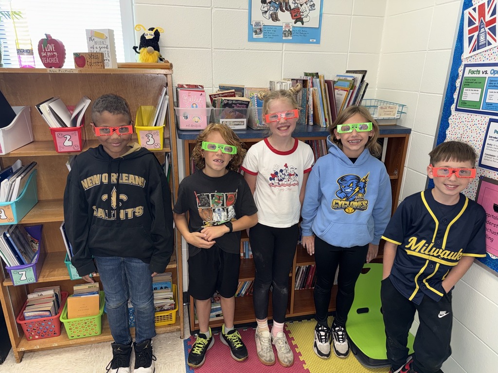 students pose with their glasses on