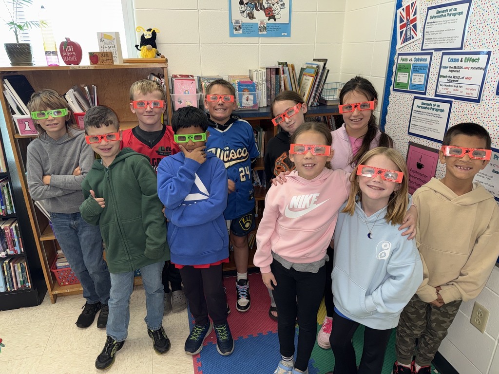 students pose with their glasses on