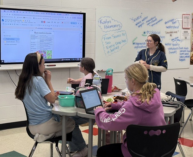 students in a classroom with a presenter