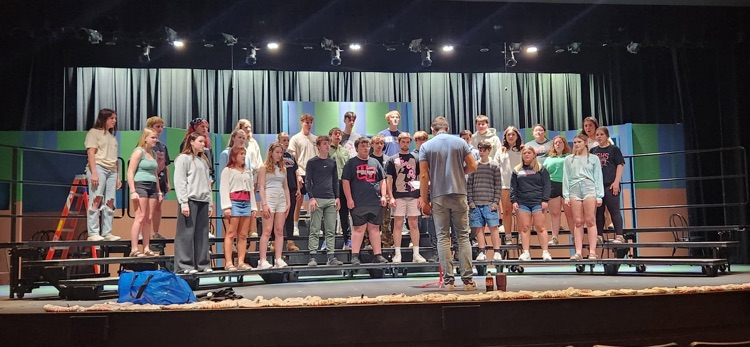 choir students on stage singing