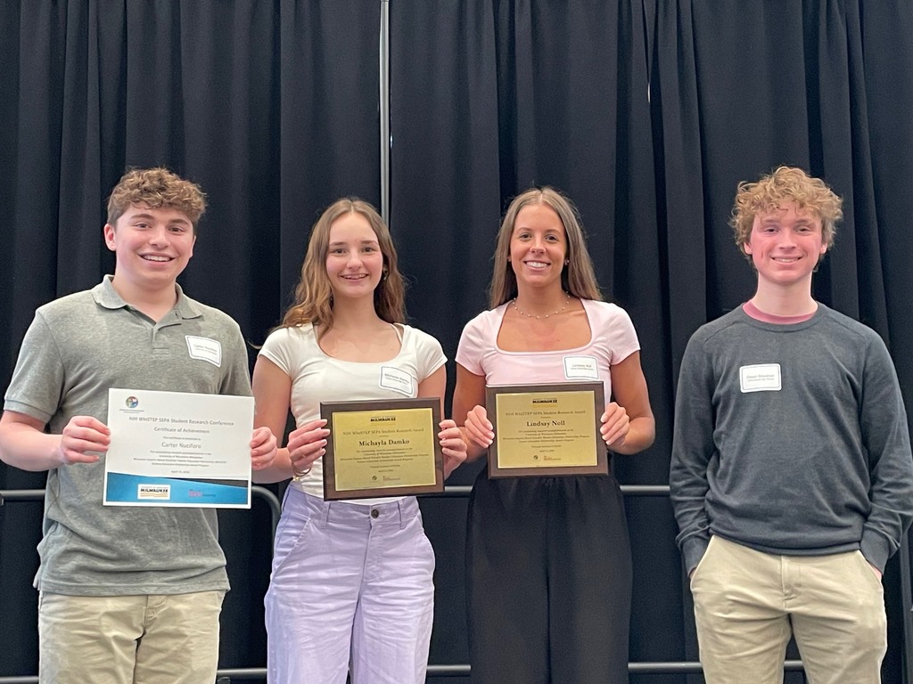 AP Bio students standing and holding awards