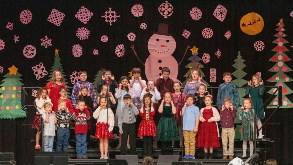 Middle and upper elementary school students from Union Star sing a Christmas song during the Christmas program.