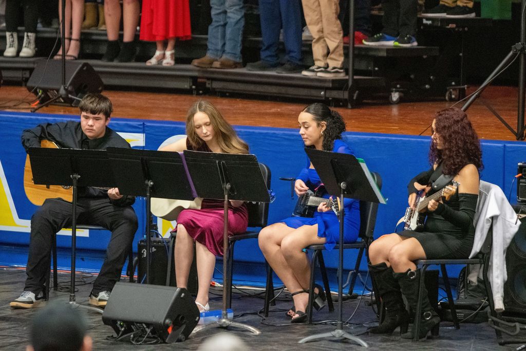 Instrumental music students from Union Star High School play guitars to a holiday arrangement during the Christmas concert.