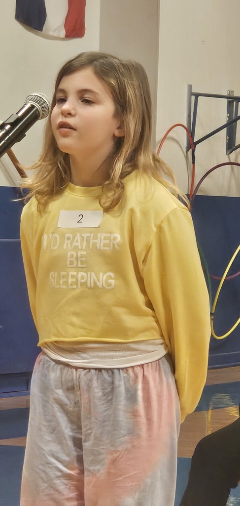 Fifth grader Morgan Ninas spells her word during the county spelling bee.