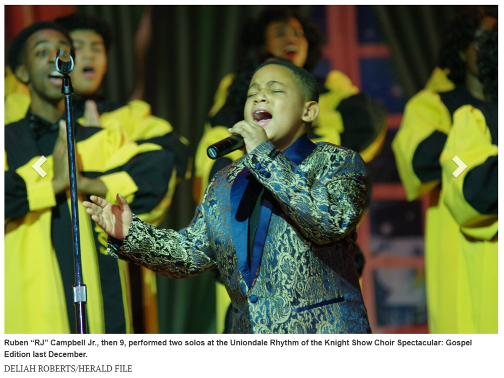 Young student singing with show choir 
