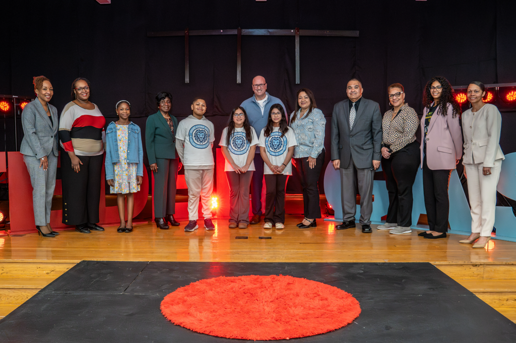 Students and board members on stage