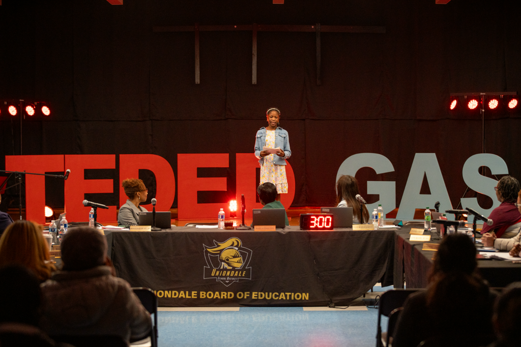 Student giving a talk on stage