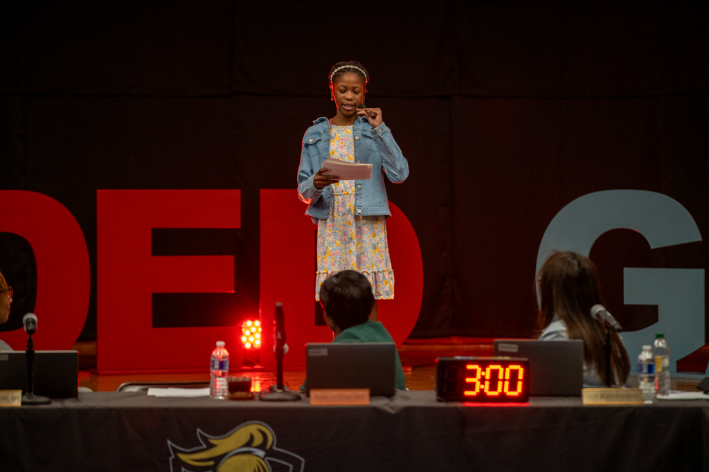Student giving a talk on stage