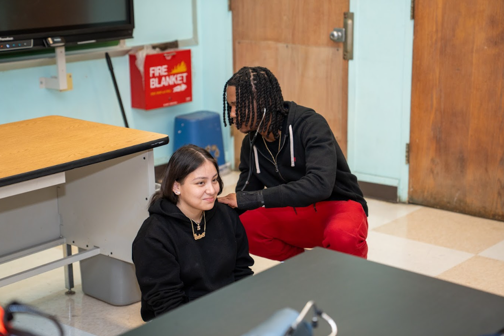 Students practicing medical aid
