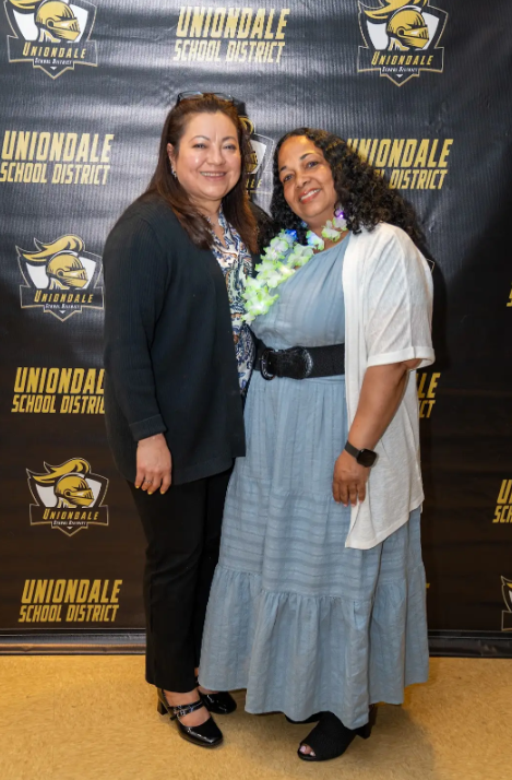 Two staff members standing together