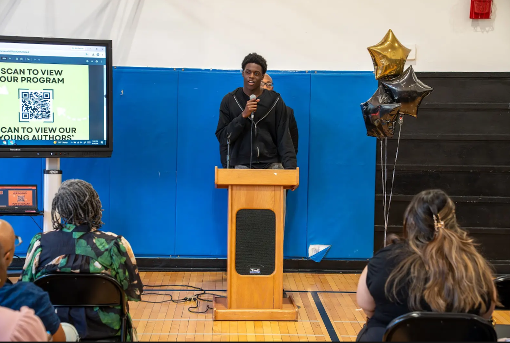 student standing at a podium