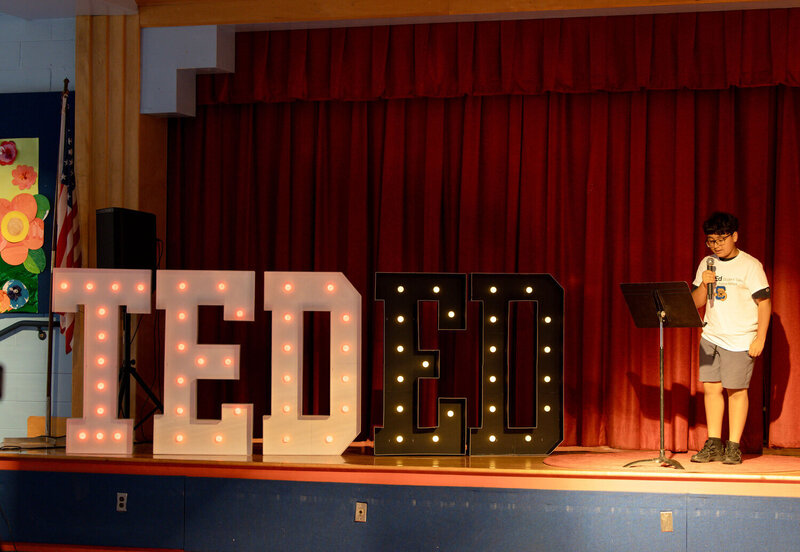As California Avenue Elementary School designed the stage with TED signs, Nicholas Rivera talked about “Excellence. He explained how excellence can help students achieve their goals.