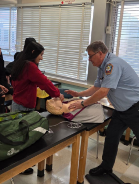 During the airway and ventilation module, EMT instructor Charlie Marfoglio showed Uniondale High School students how to use a resuscitation mask and how to keep a patient’s airway open — two of many hands-on skills students learn in the program.